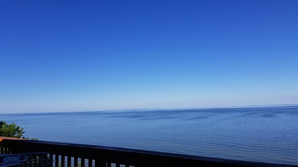 Blue sky over blue water.