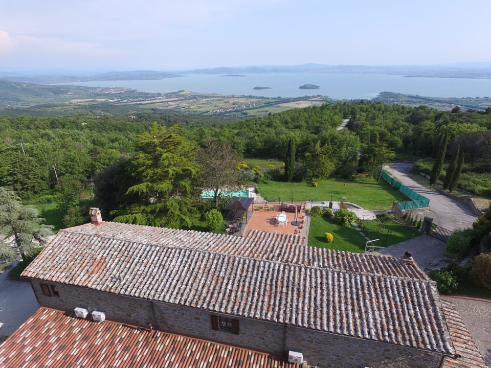 A view over the roof of the property towards Lake Trasimeno.  