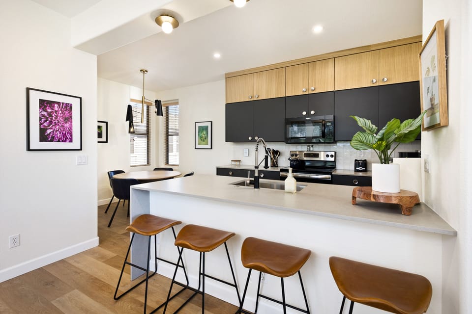 Dining area, breakfast bar, and kitchen