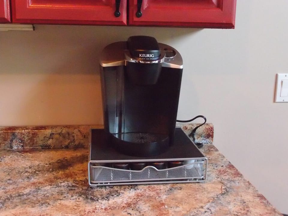 Keurig coffee maker with K-Cup organizer stand (we include a dozen starter pods)