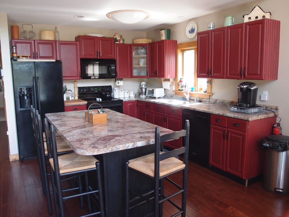 Updated kitchen with new lighting, appliances and counter tops.