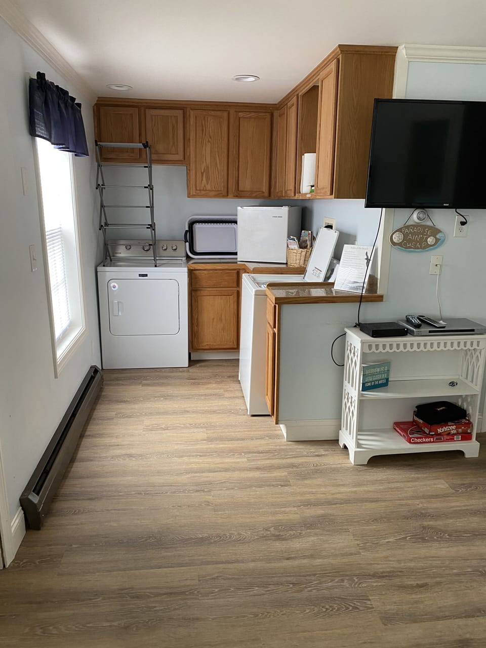 laundry area with extra cube fridge