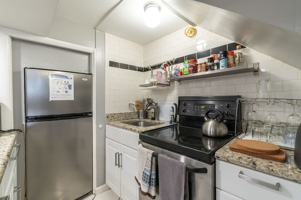 fridge/freezer, sink, stove/oven, counter space, tea kettle 