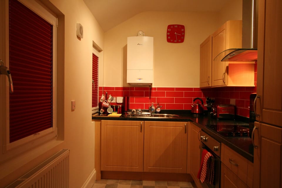 kitchen with window blindes closed