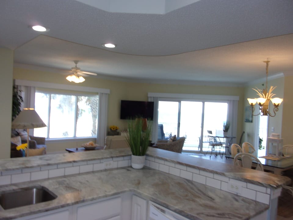 Looking from kitchen into LR and DR and out to balcony.