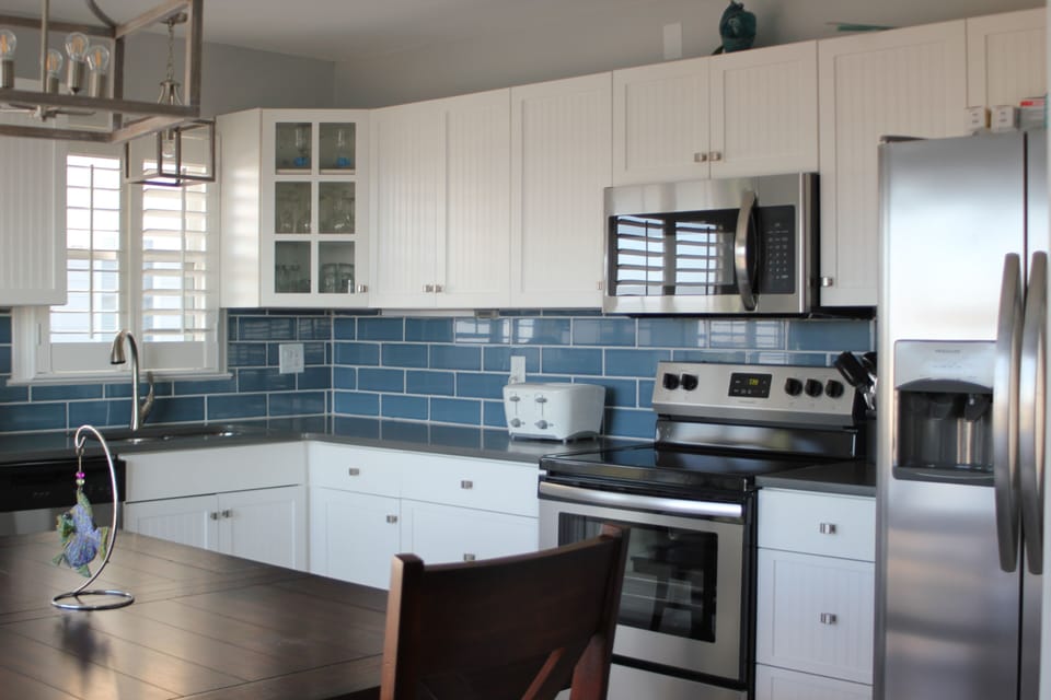Newly renovated kitchen with new stainless appliances and quartz counter tops.