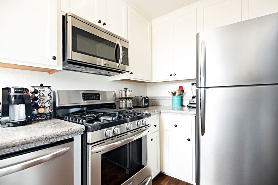 New stainless steel appliances in this fully stocked kitchen