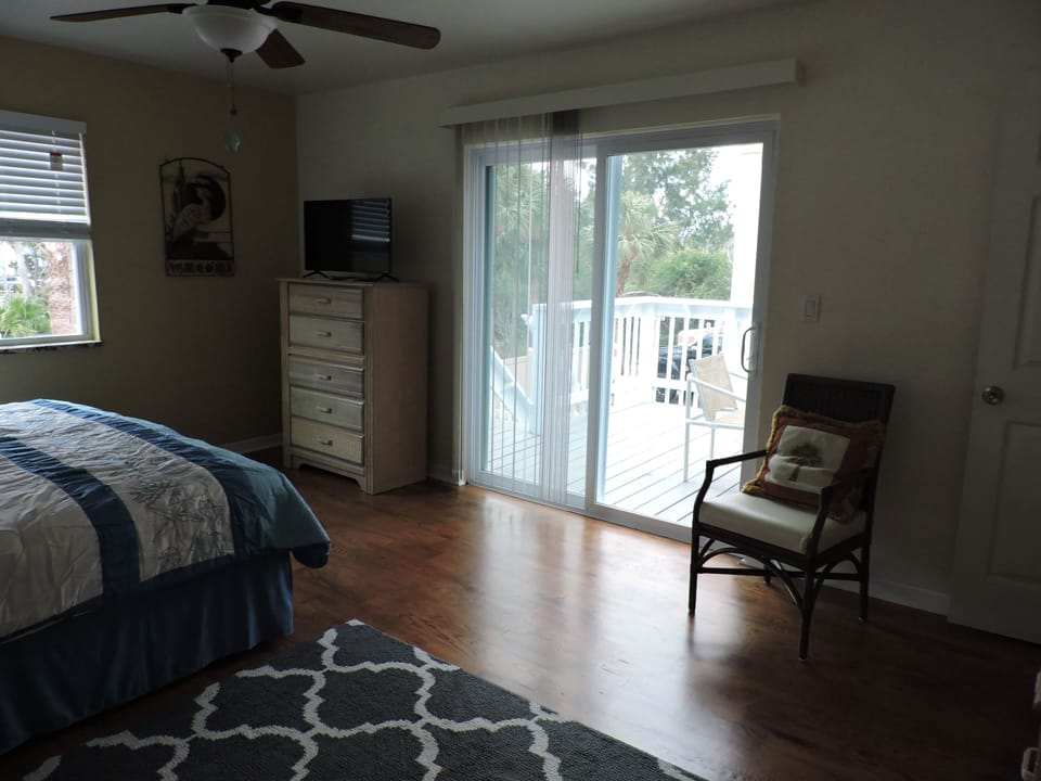 Master bedroom has access to balcony.