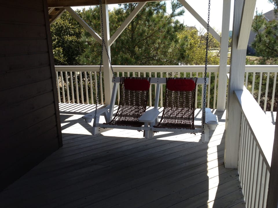Outdoor swing facing the pool