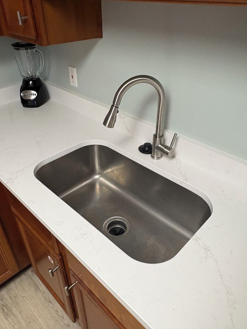 New kitchen sink (one bowl) and new kitchen faucet on new quartz countertops