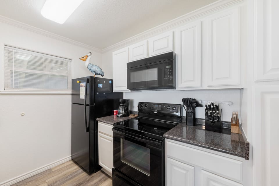 Your fully equipped kitchen features sleek granite counters, stainless appliances, and everything you need to prepare delicious meals during your stay.
