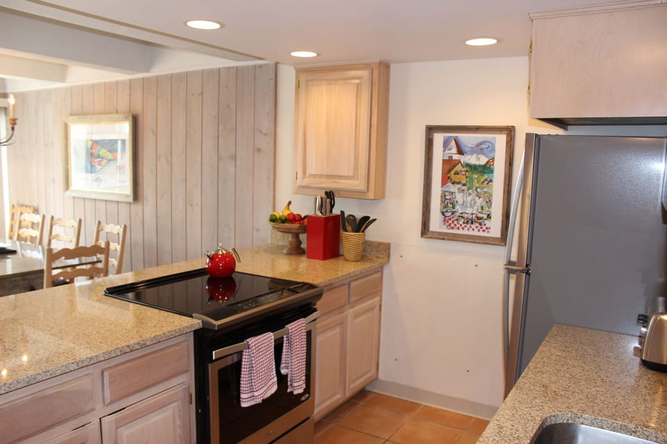 Kitchen includes a new glass stovetop and oven for the chef who likes to cook.