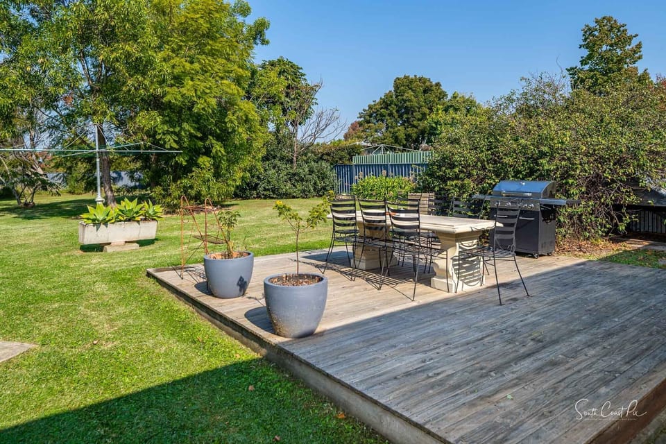 Rear deck with BBQ and large fully enclosed yard.