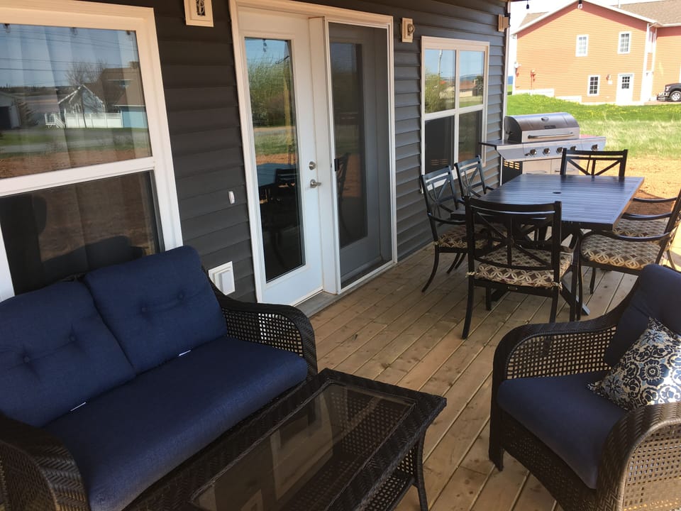Deck area complete with soft seating and dining area