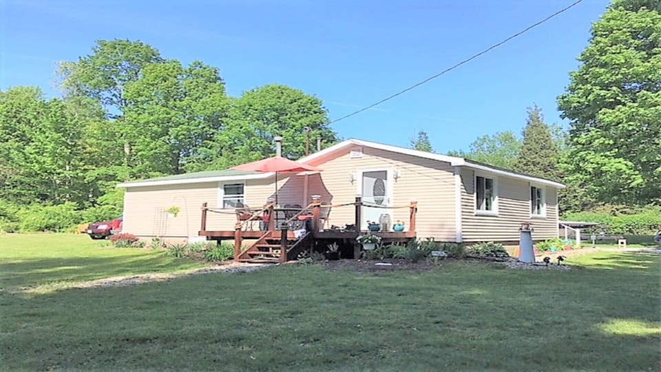 Cottage view with deck & large yard 