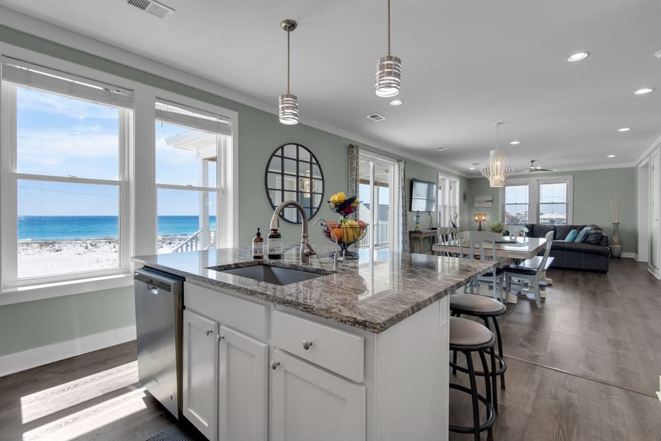 Fully stocked gourmet kitchen with a view, open floor plan, large island