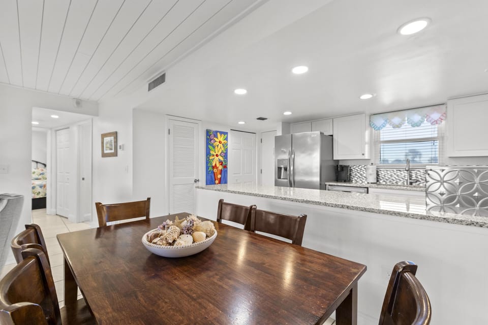 Bright, open dining area with modern kitchen views