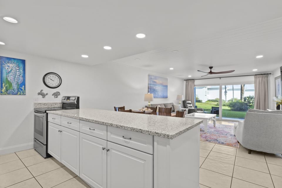 Bright, open kitchen flowing into a cozy living area