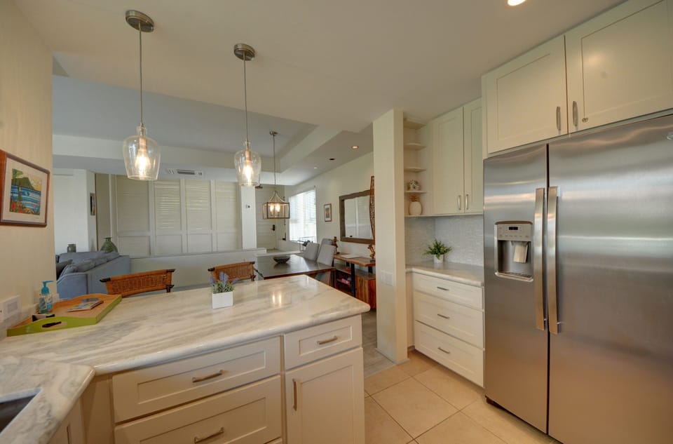 Full size refrigerator; fully stocked with cookware and dishes
