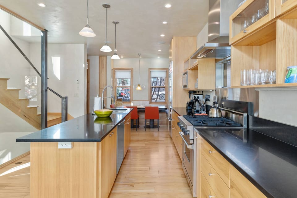 Chefs kitchen with an island/breakfast bar
