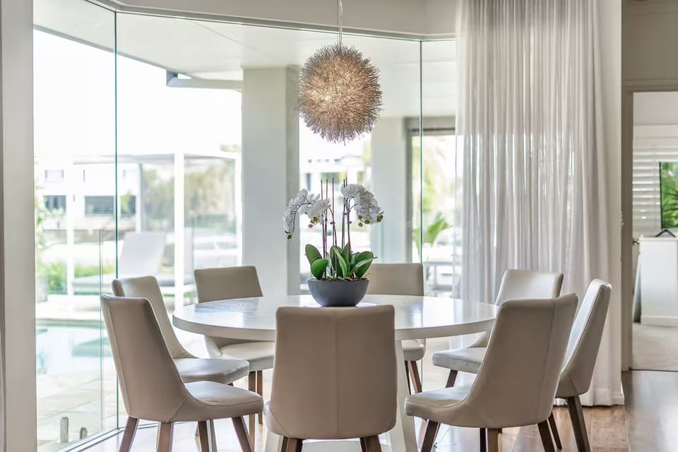 Poolside 8-seat dining beside the heated pool, spa and entertaining area