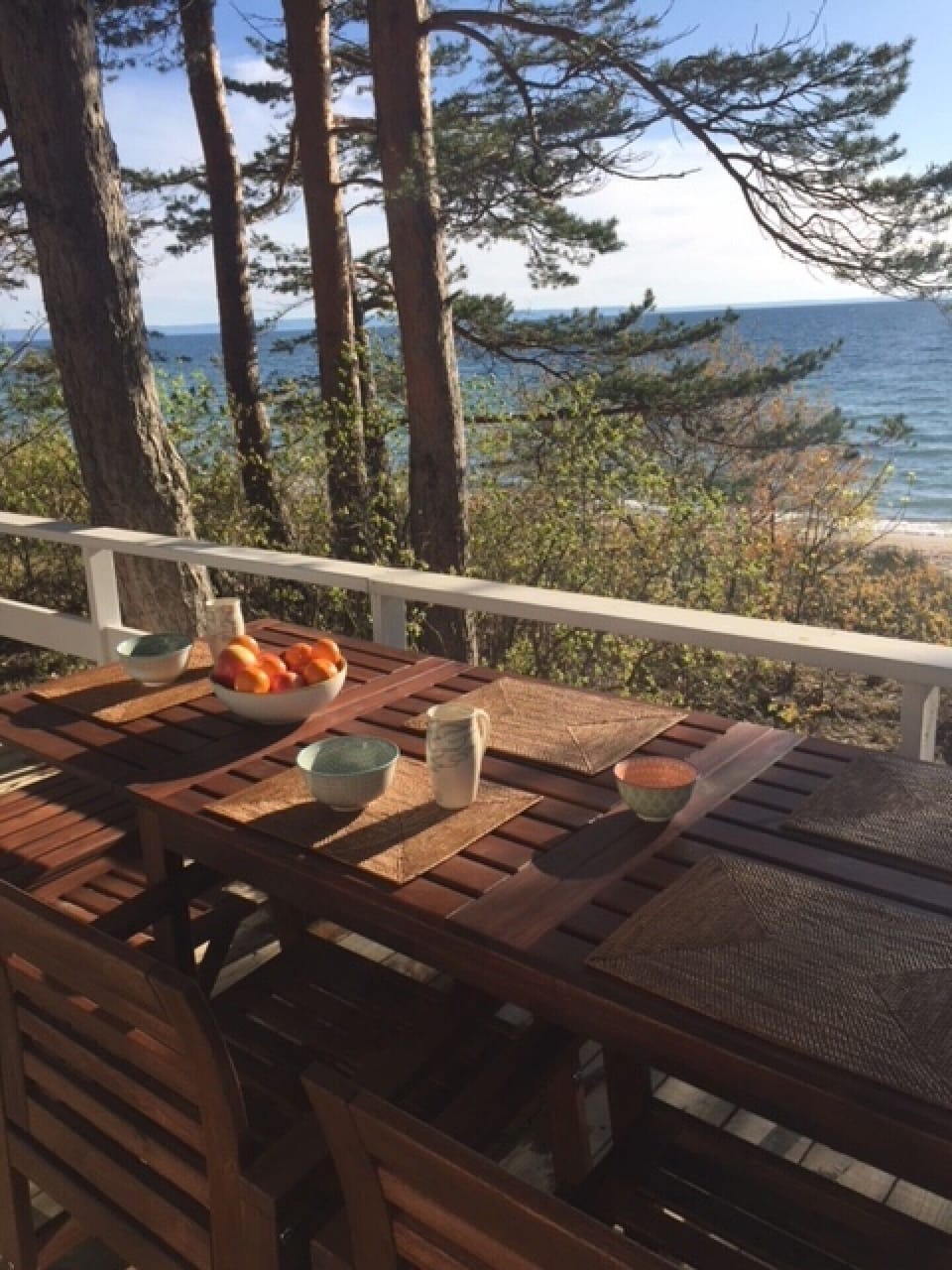 An extendable patio table on the deck has ample seating for dining al fresco or a lively board game when it's time to get out of the sun.
