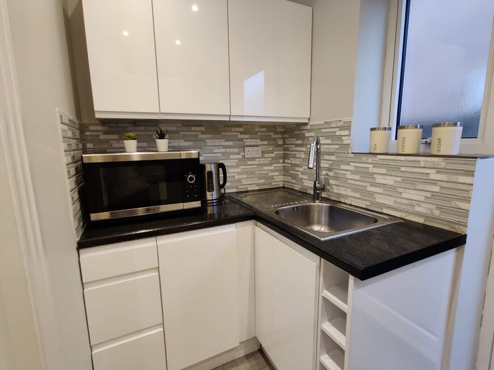 Microwave cum oven, full size sink, 24 hours hot water 