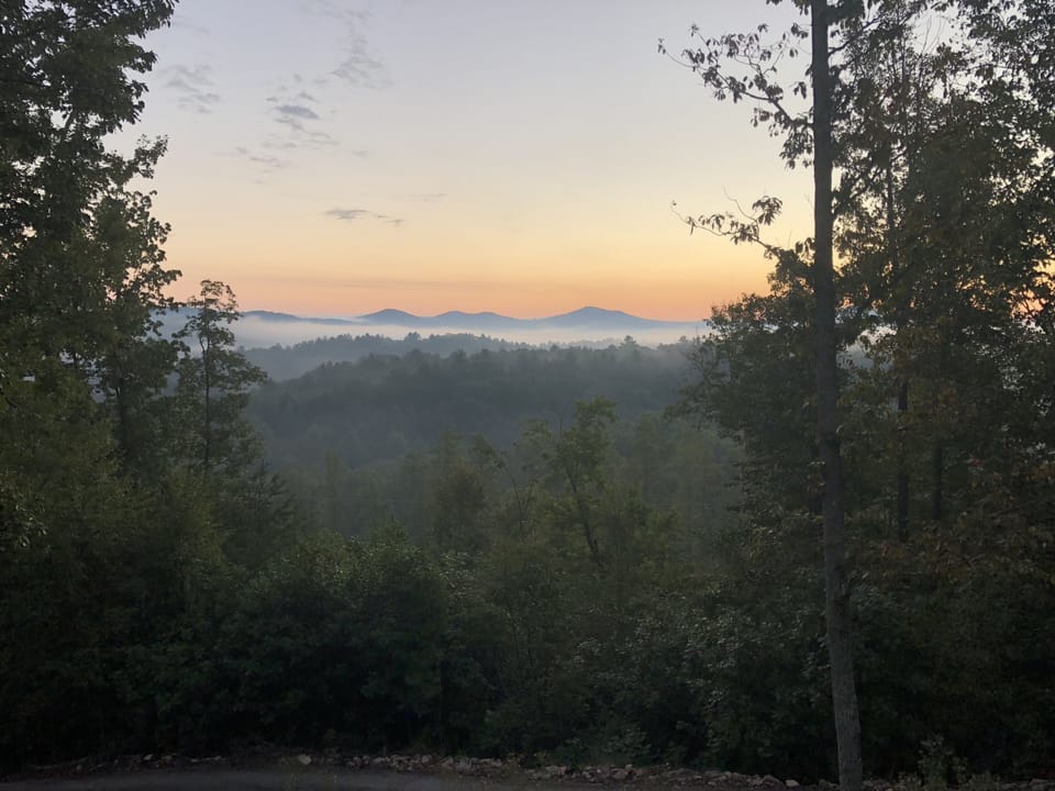 Postcard sunrise picture taken from cabin front porch! Imagine waking up to this