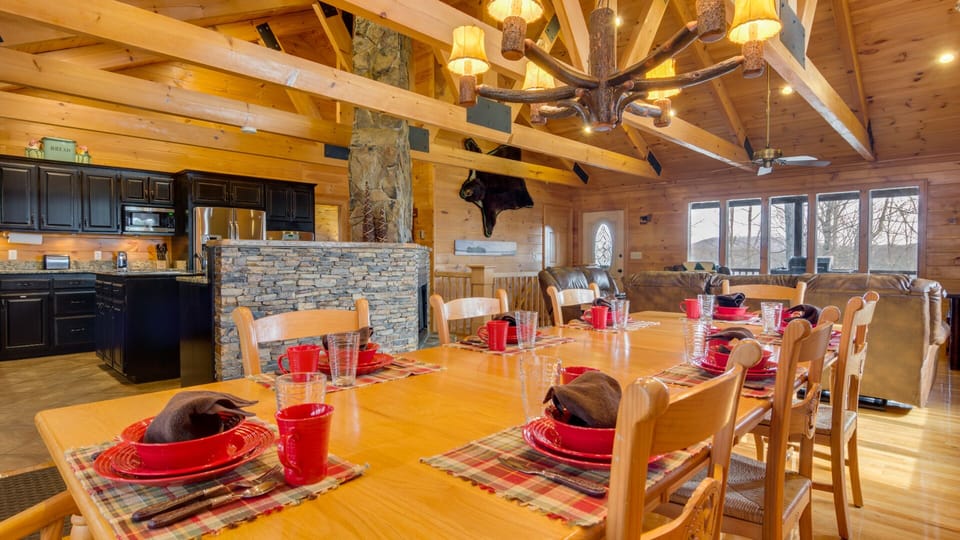 10 foot oak dining table w/ seating for 10 by stacked stone gaslog fireplace 