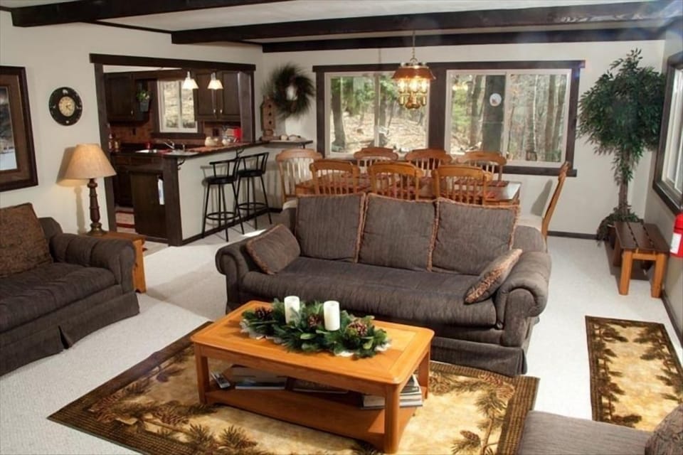 Main floor living room, dining and kitchen area.  Balcony access with Lake view