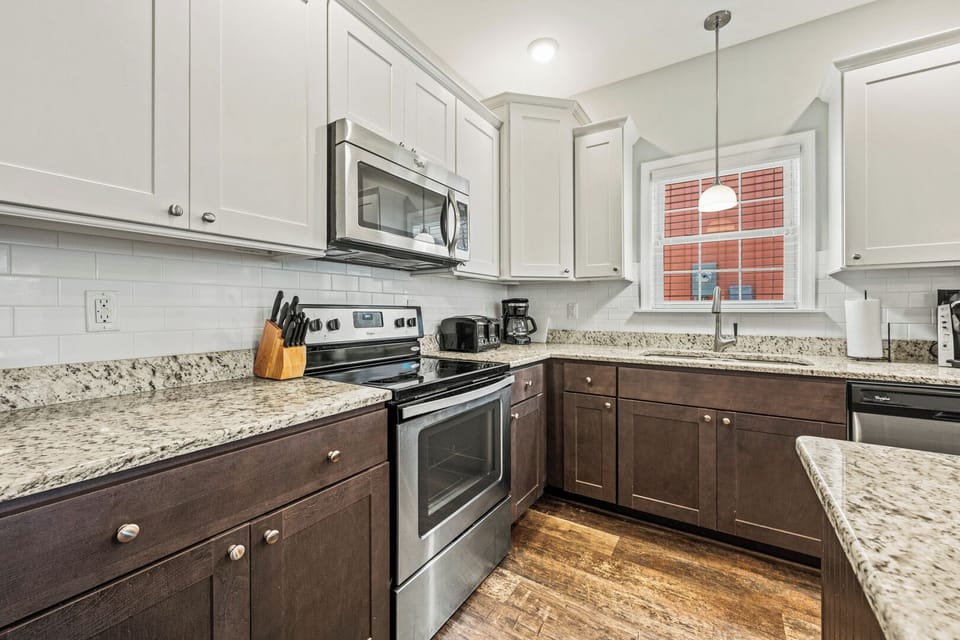 Kitchen with Bar Stool Seating on First Level