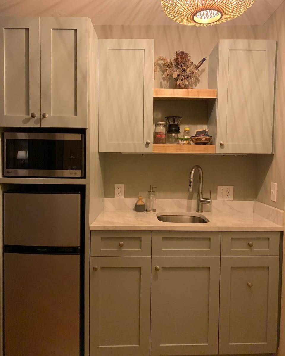 We love the warm glow that shows off this custom kitchennette 
