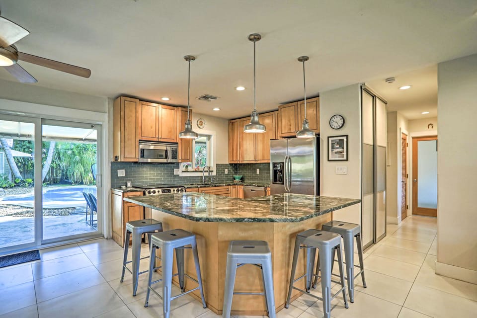 The fully equipped kitchen features stainless steel appliances.