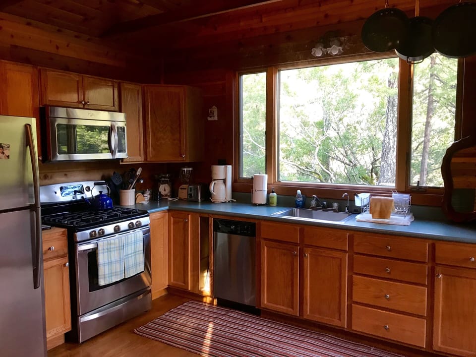 Our kitchen is equipped with modern appliances, including a gas stovetop.
