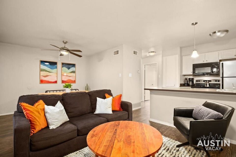 Living room with sleeper sofa, conversation seating and smart TV