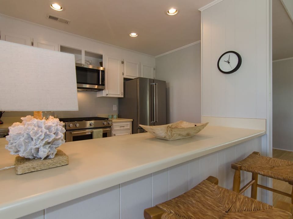 Cooks kitchen with gas range.