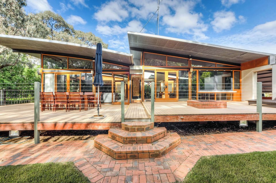 Deck area overlooking gardens and bushland