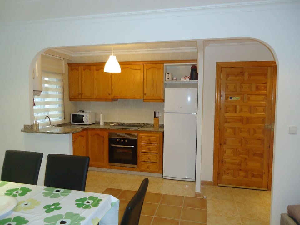 Kitchen section, equipped with what is needed to cook, microwave oven, oven...