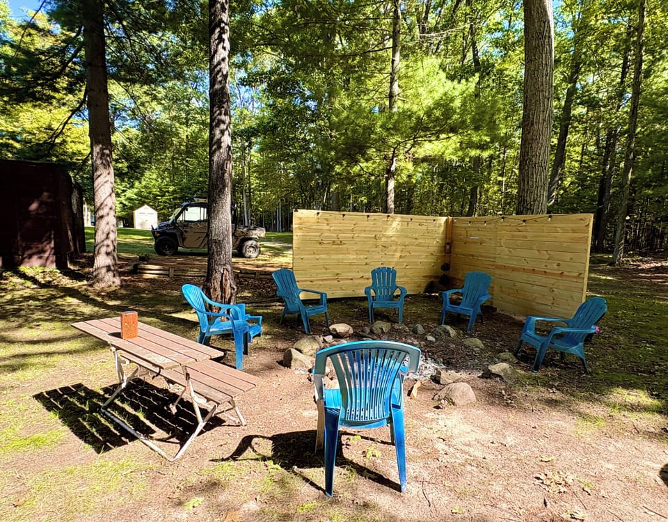 Huge backyard with fire pit to enjoy .