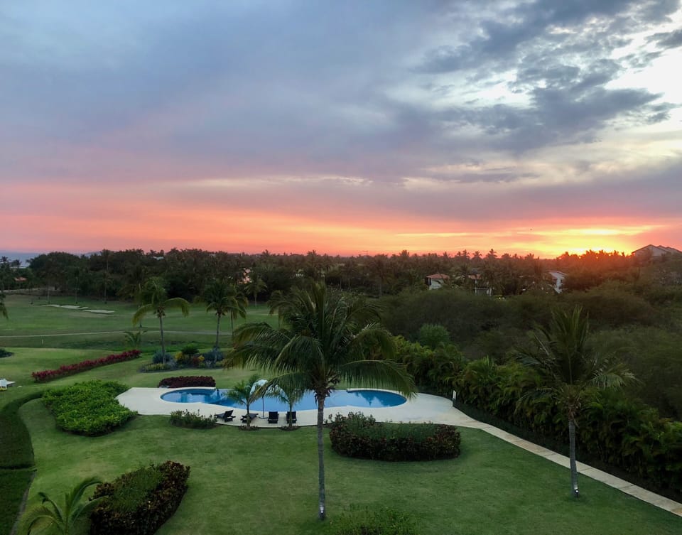 Sunset view from condo.  Pool for building 12.