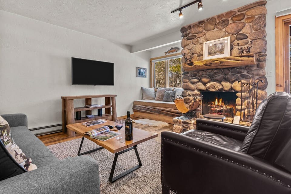 Living Room with Wood Fireplace (Wood Not Included)