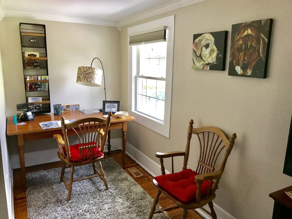 Resource area w/desk, office supplies, vacation guides & reading materials.