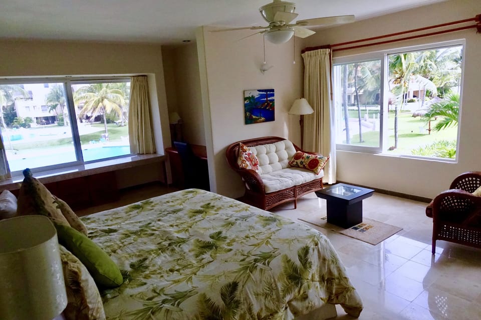 Large master bedroom c 205 with  king size bed, sitting area, windows on 3 sides