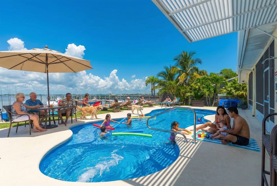 Heated in-ground pool features privacy fencing and safety gates. 