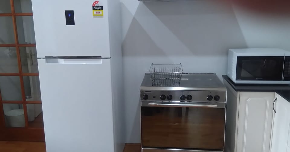 Kitchen area -Refrigerator/Freezer, European Gas Stove / Grill, Range Hood