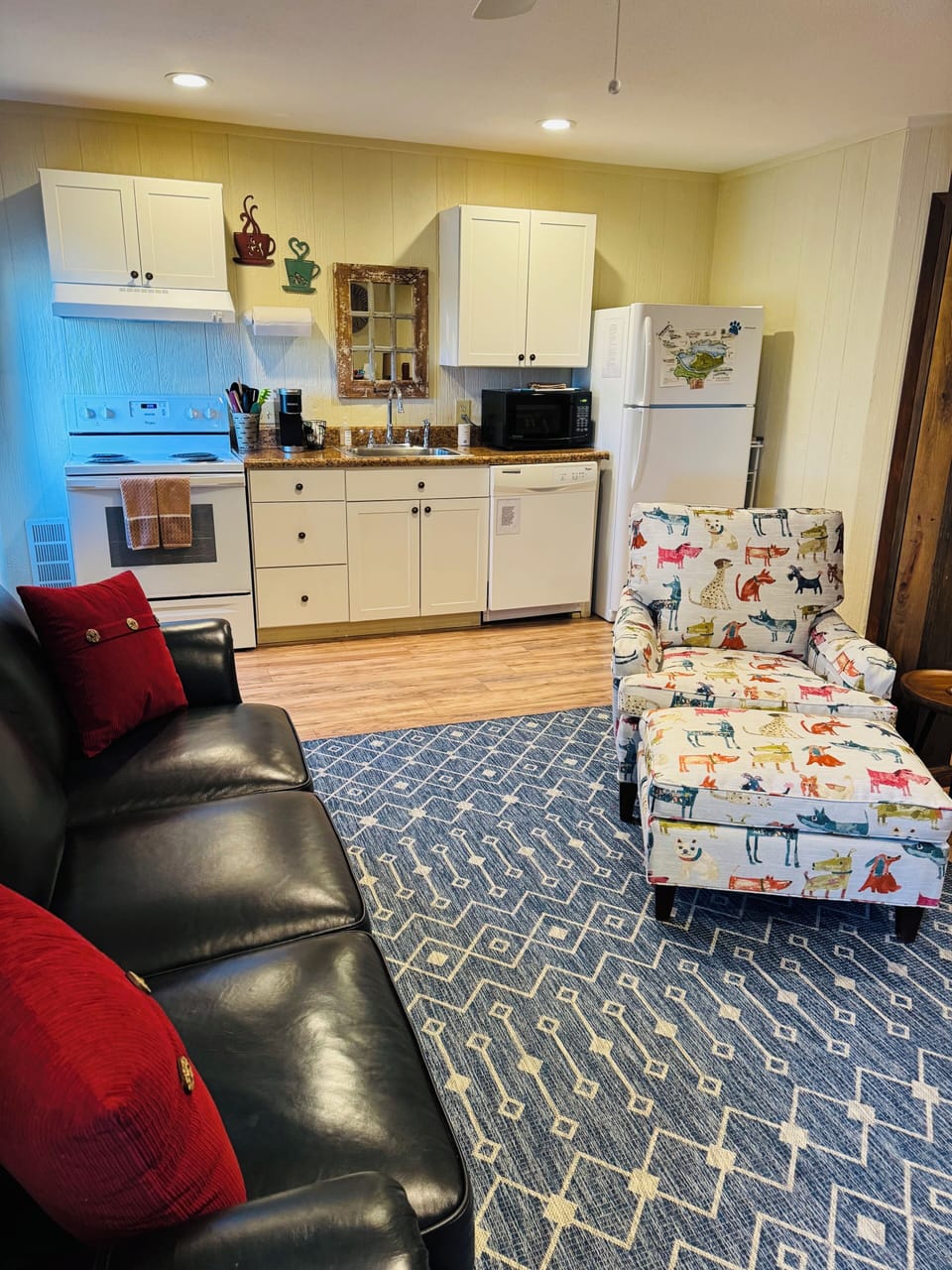 Queen leather sleeper sofa with Sealy Royale mattress, easy chair, full kitchen