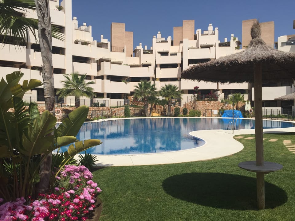 Outdoor swimming pools - one at back side, one at front side of the complex.