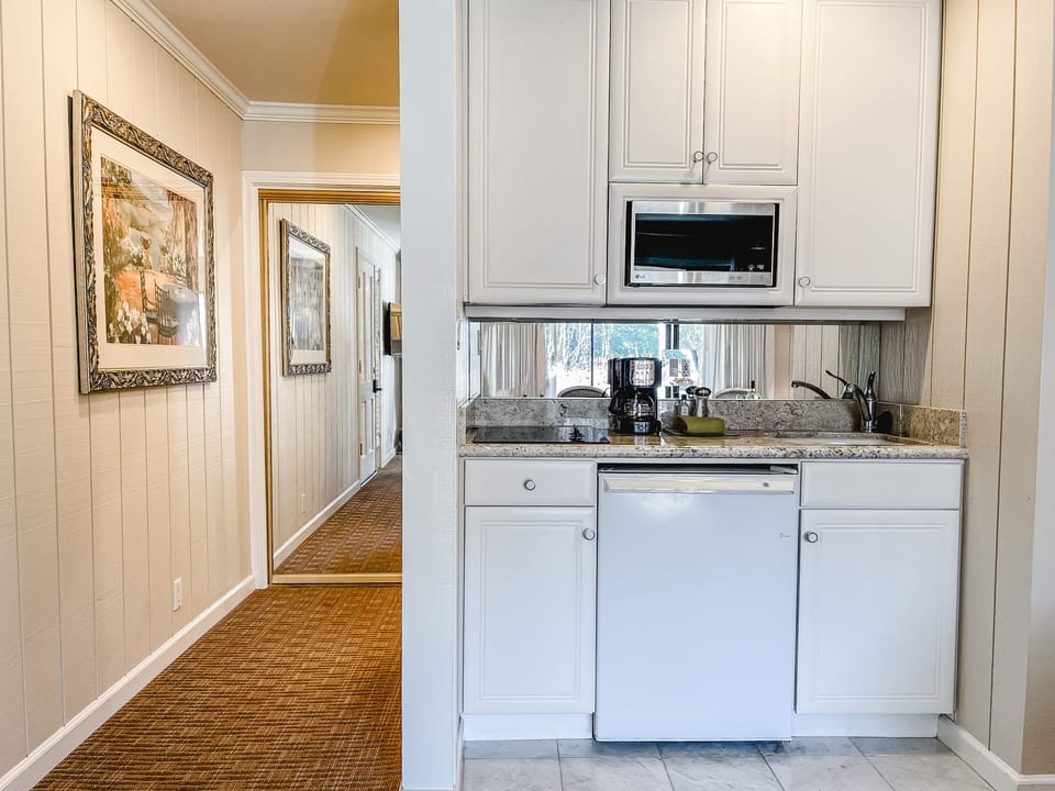 Kitchenette, stovetop, mini fridge, sink
drip coffee pot, pans, dishes, etc