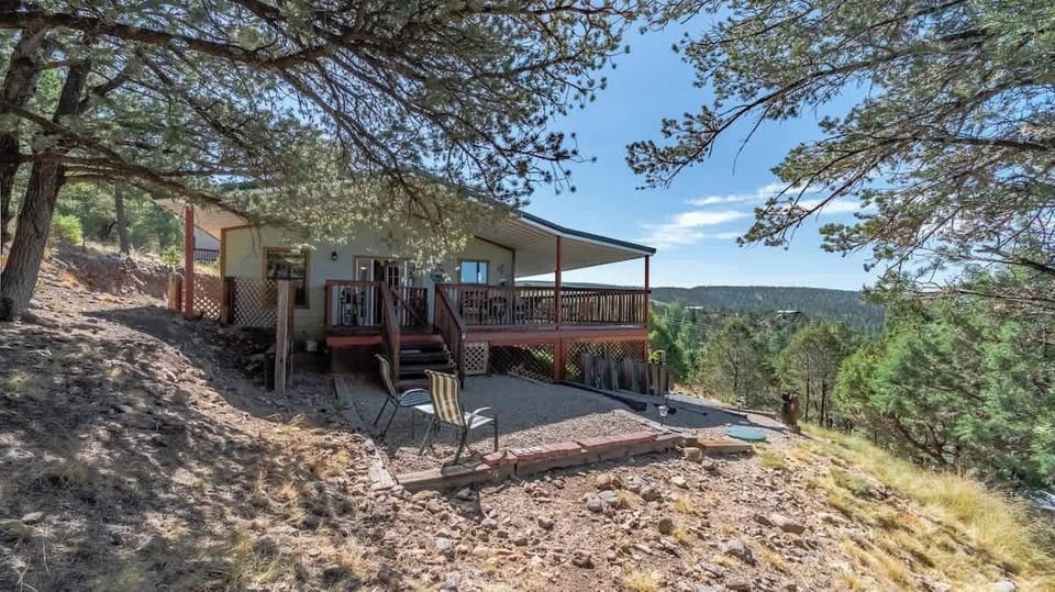 Raindance Retreat — cozy 2BR cabin with private hot tub and Sierra Blanca views.