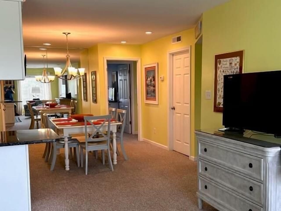 dining area leading to bedrooms 2 and 3 